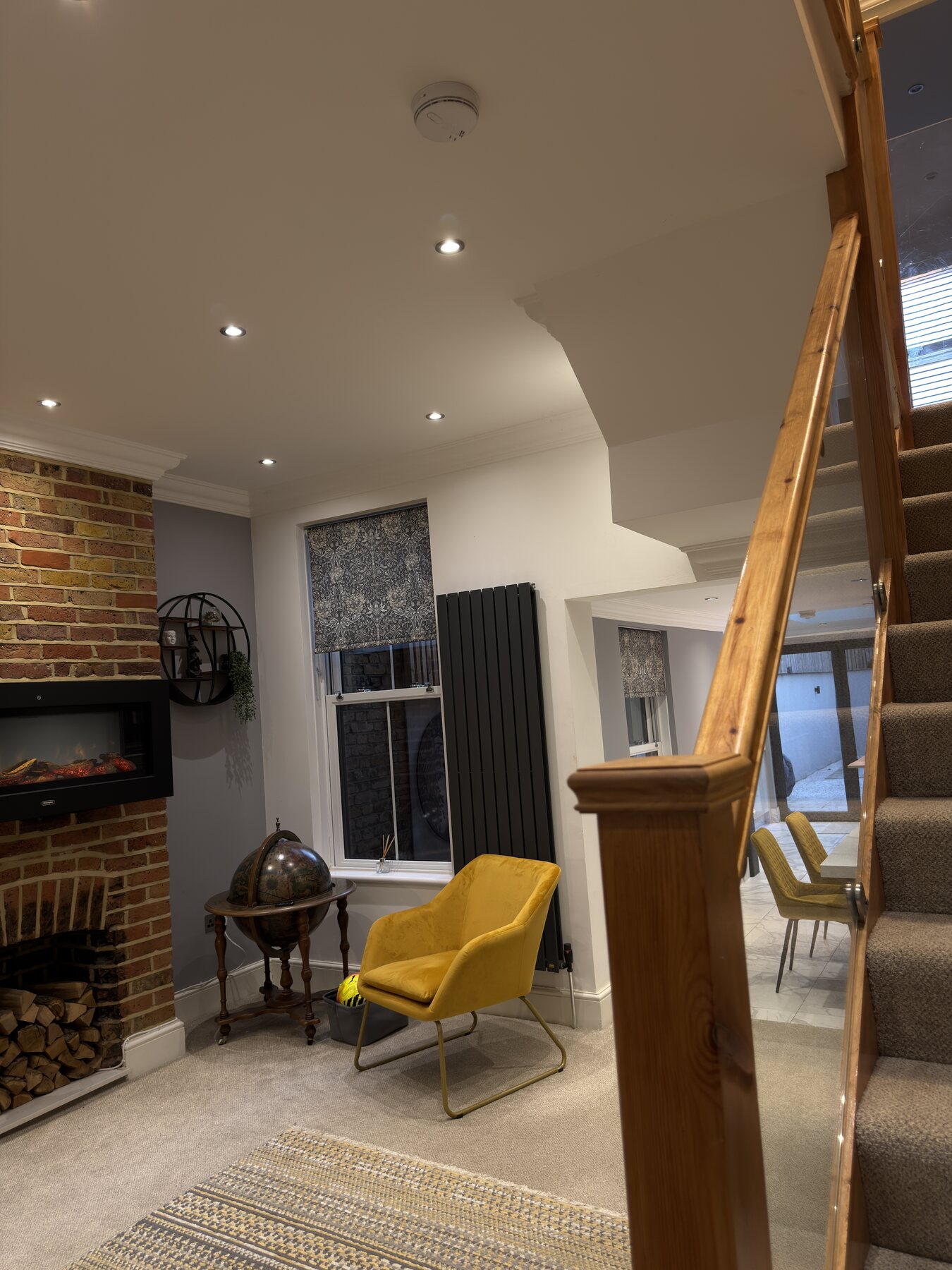Premium Redwood interior finish with staircase, fireplace and refined lighting